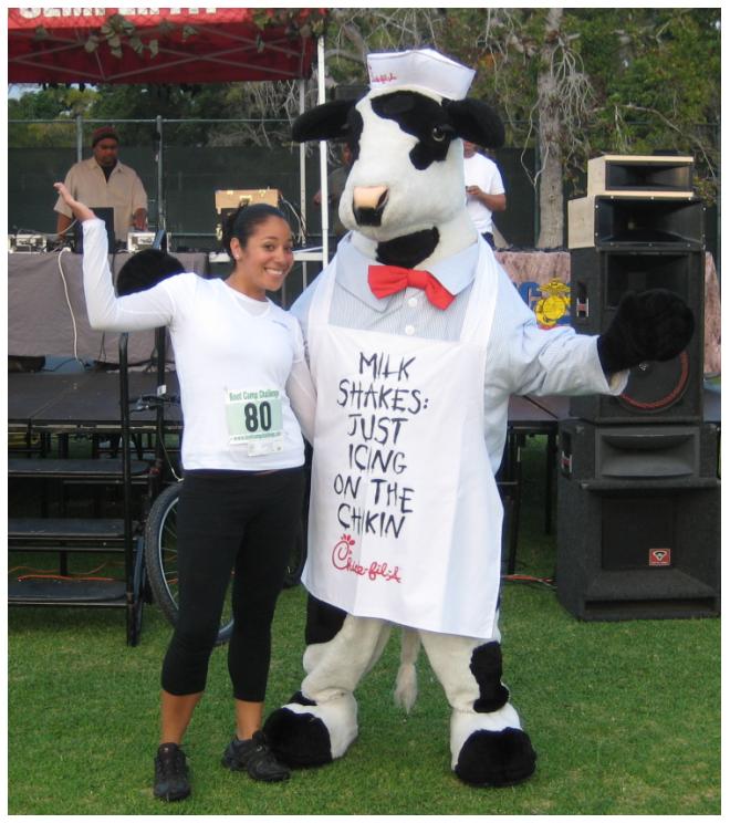 Rocio hanging out the the Chick-fil-A cow.