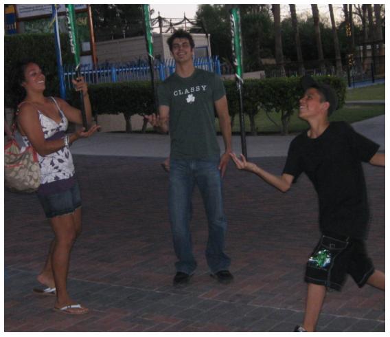 Me, Rocio and Ricky trying to balance the bat on an open hand.